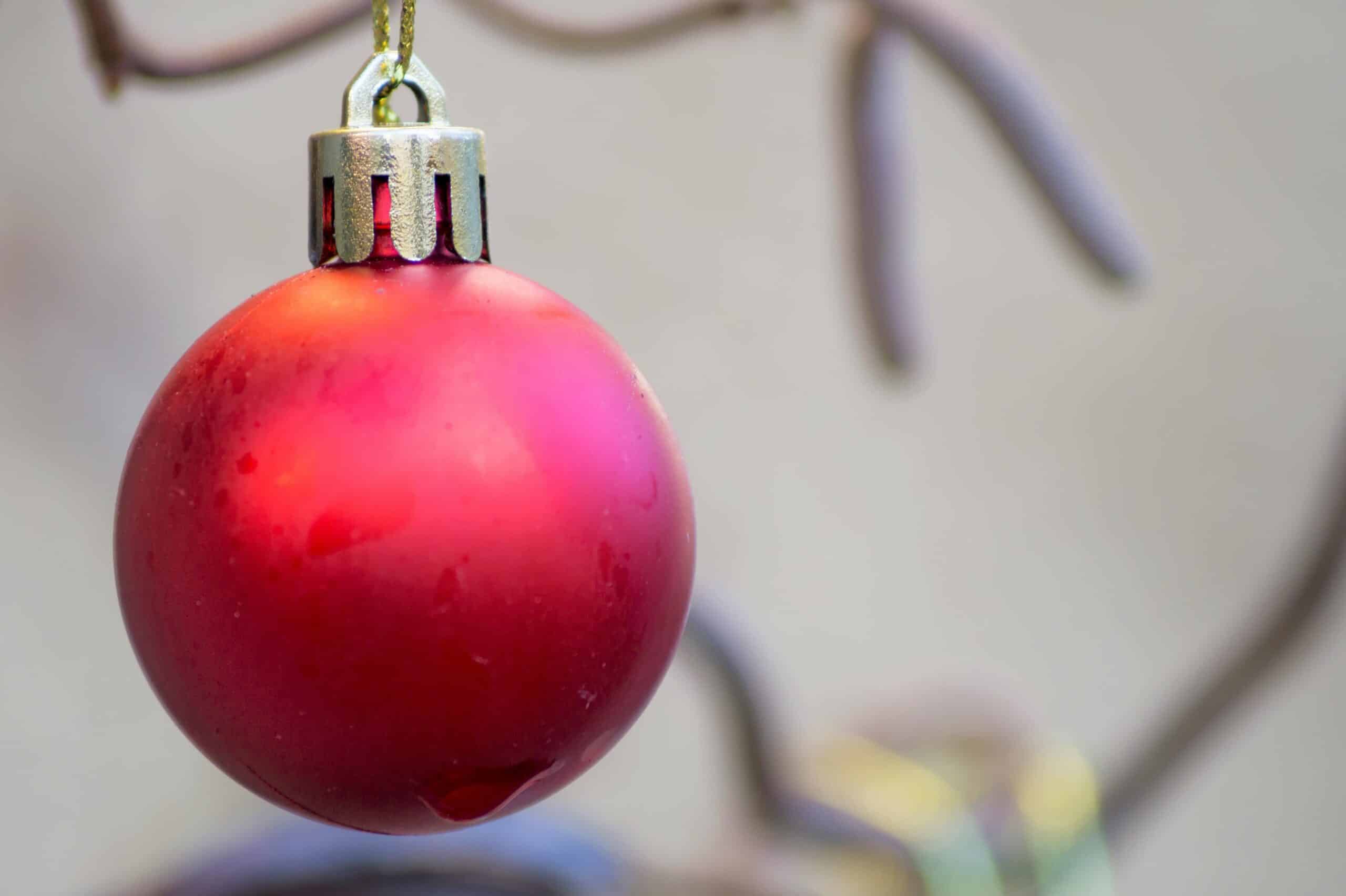 Close-up of a red Christmas ornament hanging, perfect for holiday themes.