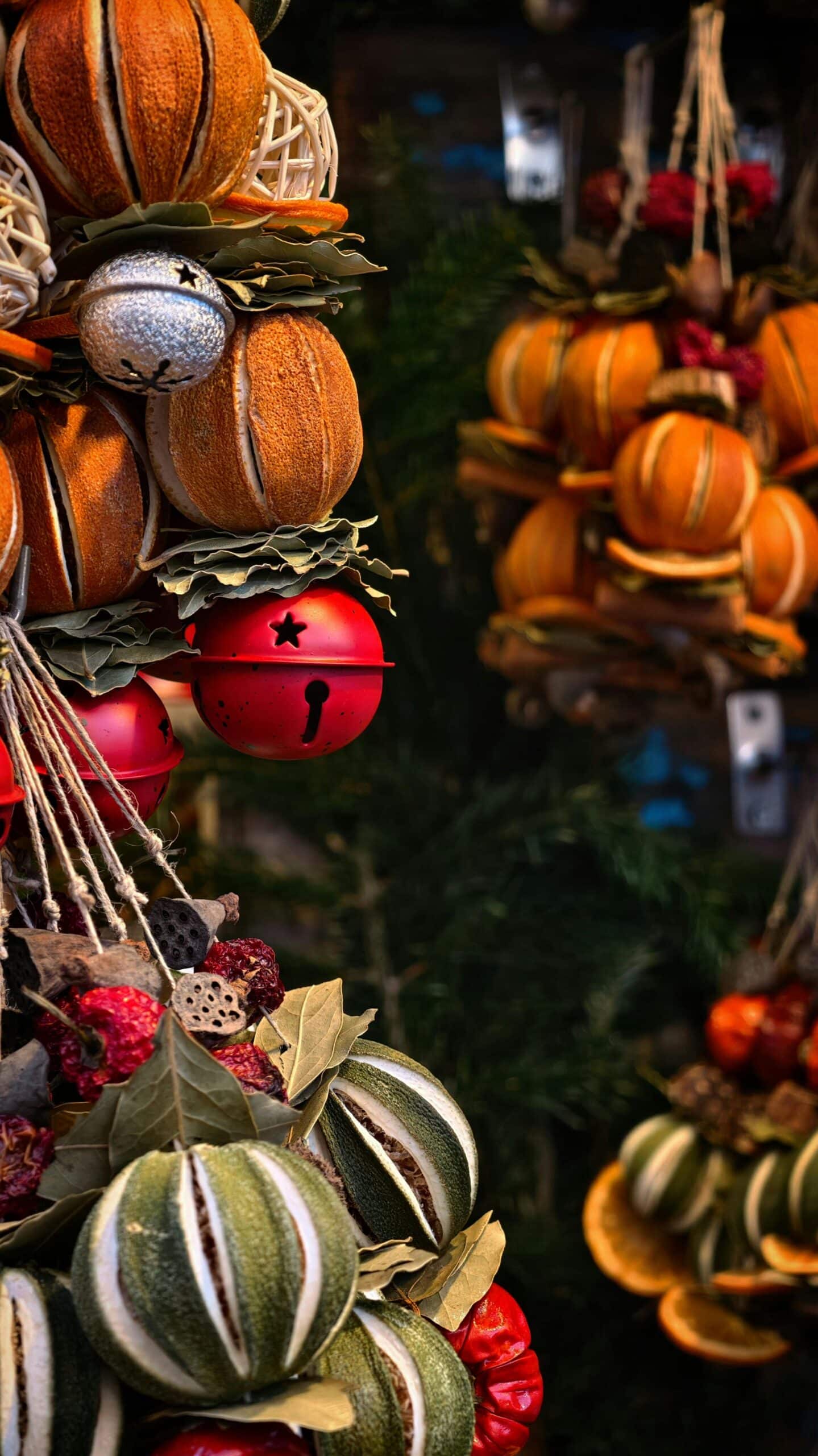 Festive arrangement of colorful dried fruit and ornaments for holiday decor.