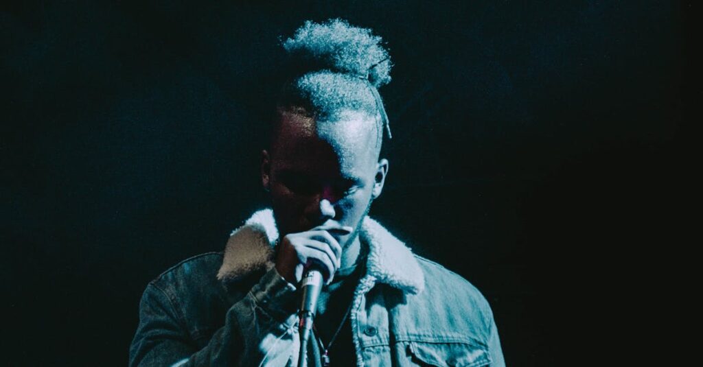 Dramatic image of a rapper performing under spotlight, wearing a stylish jacket, highlighting hip-hop culture.